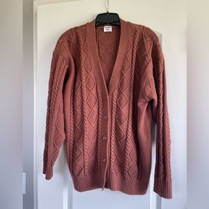 Sunday Best brown cable-knit sweater.